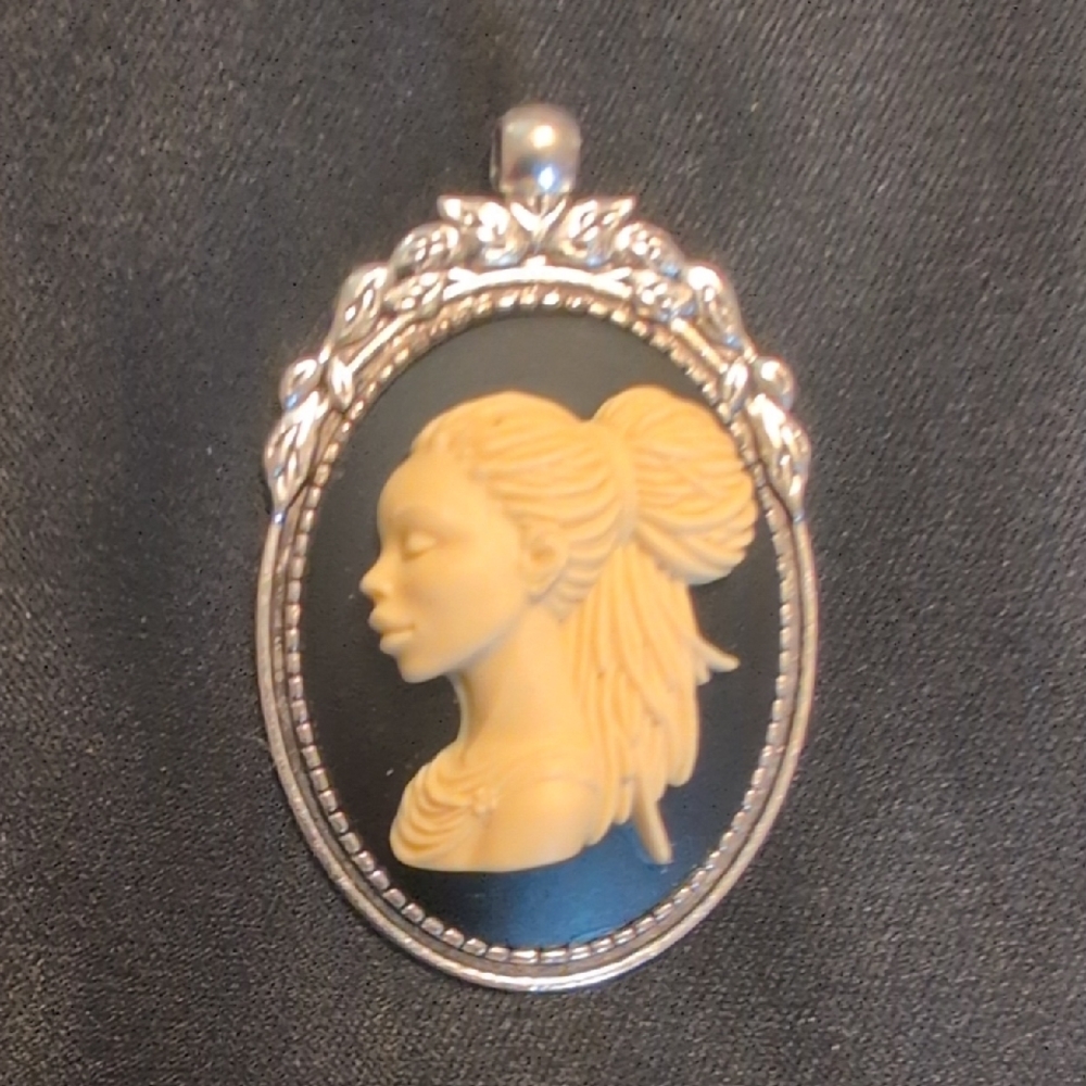 Elegant Silver and Cream Cameo Pendant